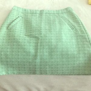 Mid rise mint green skirt with dot pattern